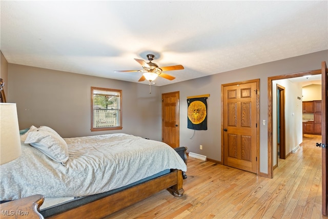 bedroom featuring ceiling fan and light hardwood / wood-style flooring