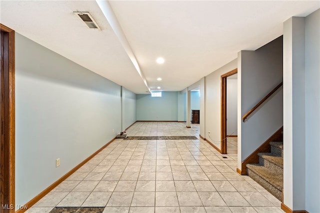 empty room with light tile patterned floors