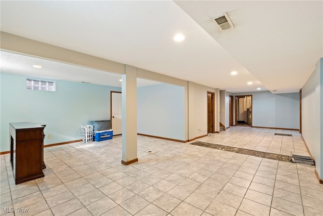 basement with light tile patterned flooring