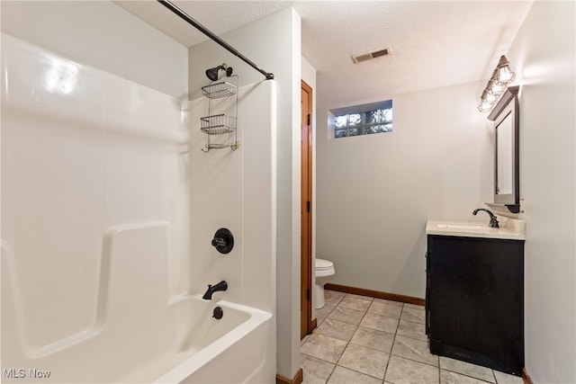 full bathroom featuring tub / shower combination, a textured ceiling, tile patterned flooring, vanity, and toilet