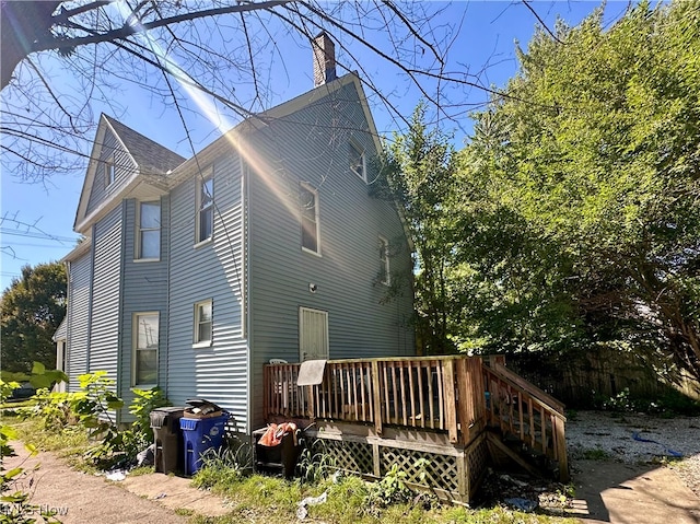 back of property with a wooden deck