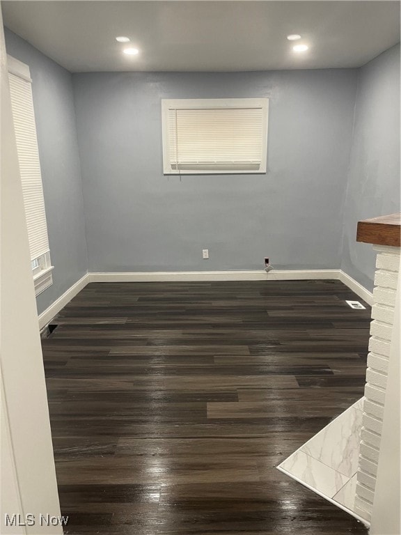 spare room with wood-type flooring