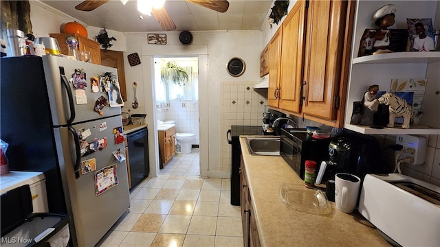 kitchen with light tile patterned flooring, ornamental molding, tile walls, dishwasher, and ceiling fan