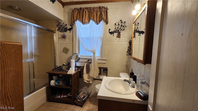 full bathroom with tile patterned floors, enclosed tub / shower combo, vanity, crown molding, and toilet