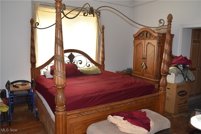 bedroom with wood-type flooring