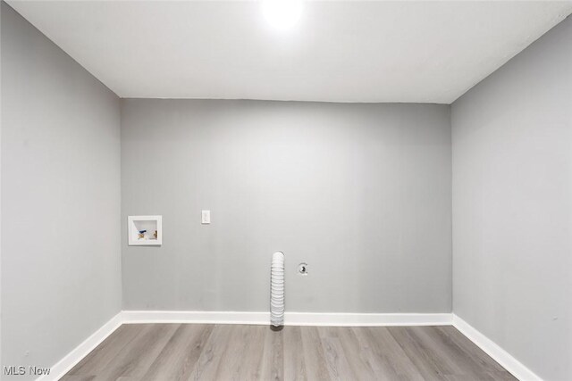 laundry room with hookup for a washing machine and light hardwood / wood-style floors