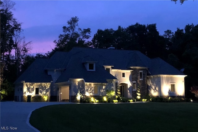 view of front of home with a lawn