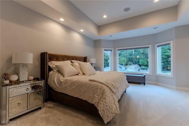 bedroom featuring light carpet