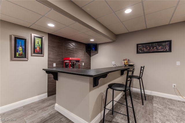 bar featuring wood-type flooring