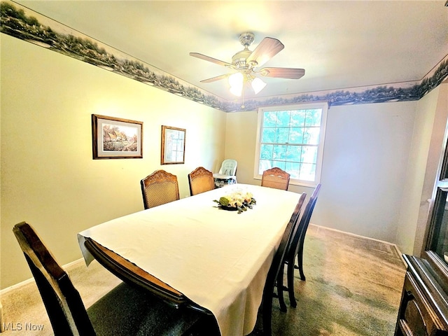 dining room with carpet flooring and ceiling fan