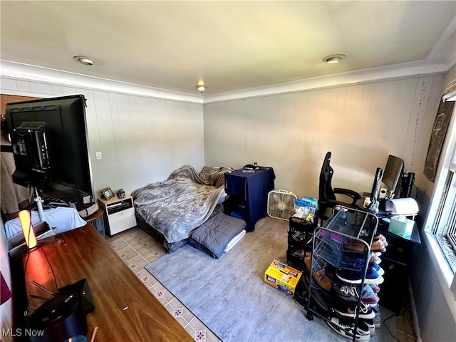 bedroom with wood walls