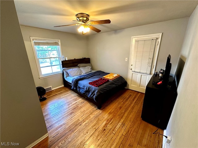 bedroom featuring ceiling fan and light hardwood / wood-style flooring