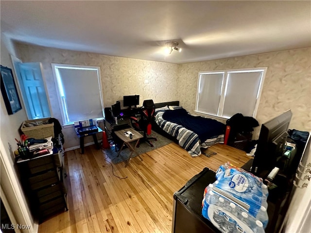 bedroom with hardwood / wood-style floors