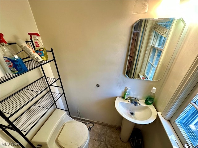 bathroom featuring tile patterned floors and toilet