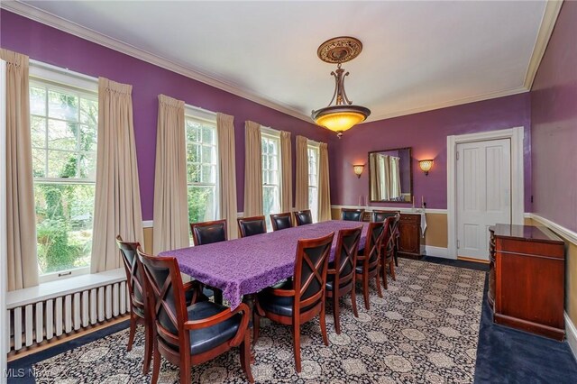 dining room featuring radiator and ornamental molding