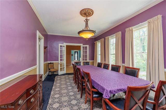 dining space with crown molding