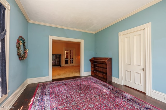 interior space featuring crown molding and wood-type flooring