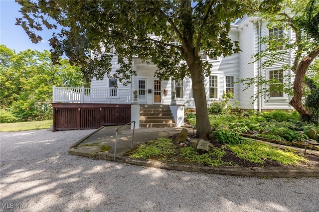 view of front of house with a wooden deck