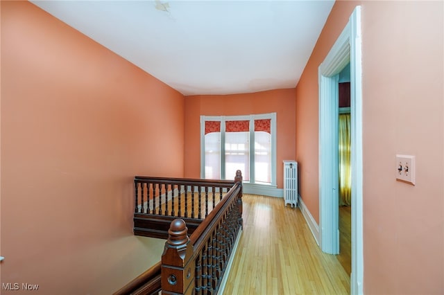 corridor with light hardwood / wood-style floors