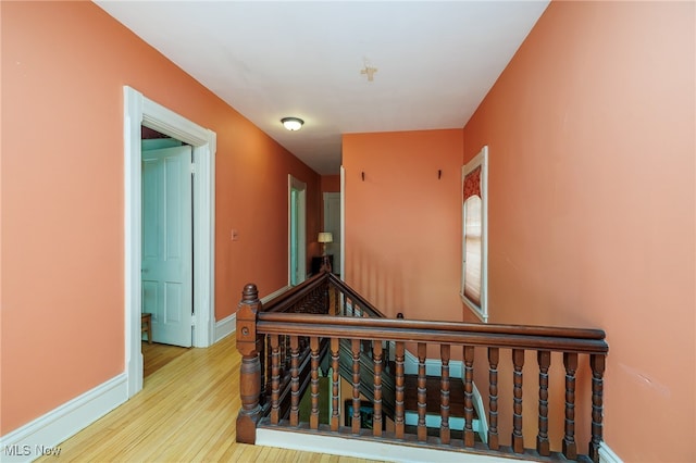 staircase featuring wood-type flooring