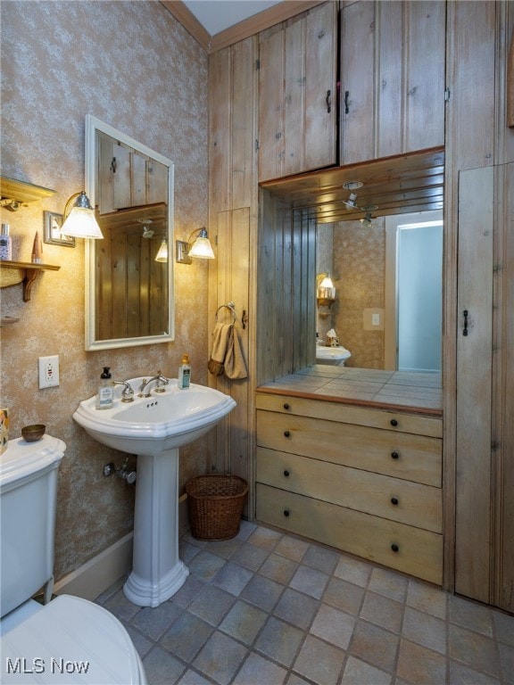 bathroom with tile patterned flooring and toilet