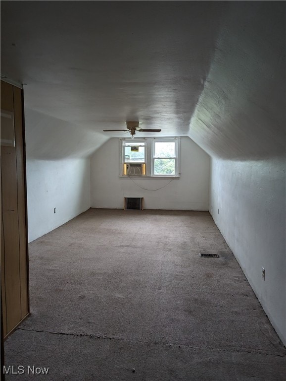 bonus room with ceiling fan, light colored carpet, cooling unit, and vaulted ceiling