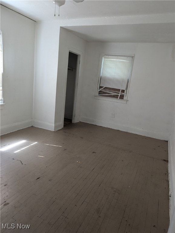 unfurnished room with ceiling fan and hardwood / wood-style floors