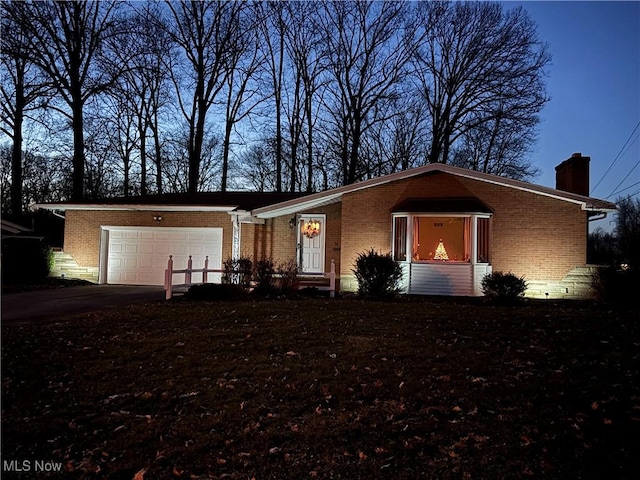 ranch-style home with a garage