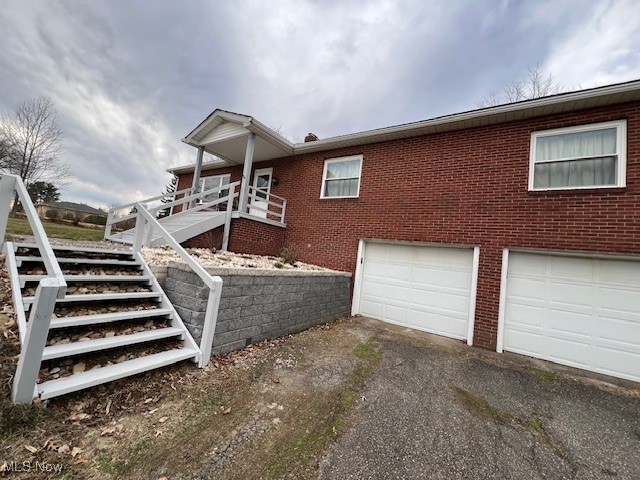 view of property exterior featuring a garage