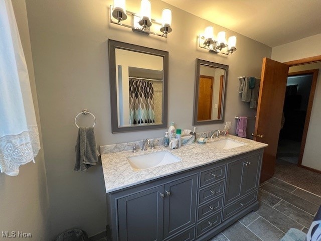 bathroom with tile patterned floors and vanity