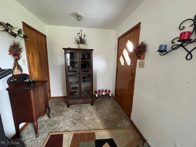 view of carpeted entrance foyer