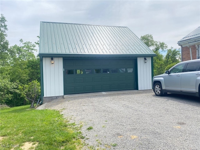 garage featuring a lawn