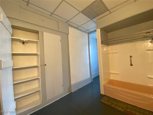 basement featuring a paneled ceiling