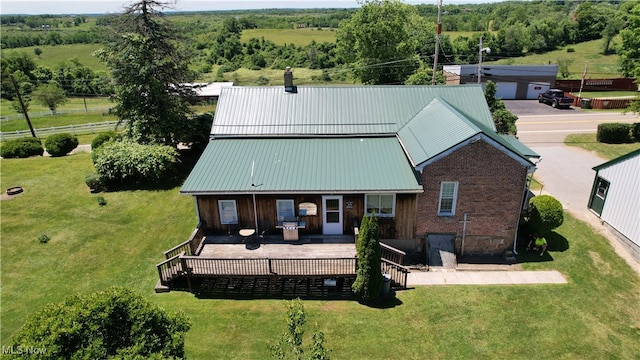 exterior space with a lawn and a wooden deck