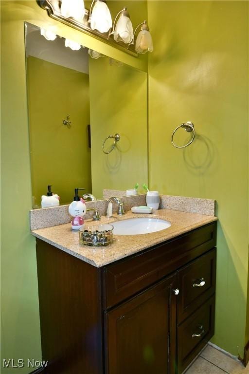 bathroom with tile patterned flooring and vanity