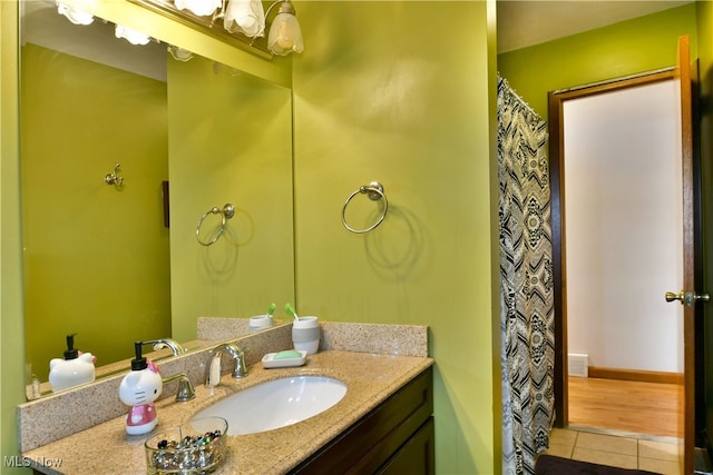 bathroom with hardwood / wood-style flooring and vanity