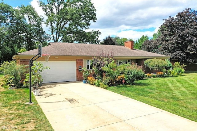 ranch-style house with a garage and a front lawn