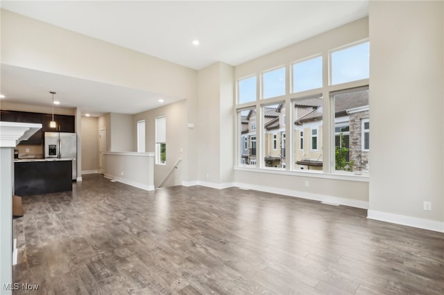 unfurnished living room featuring wood-type flooring