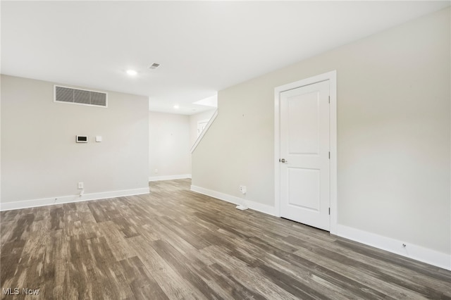 empty room with hardwood / wood-style floors