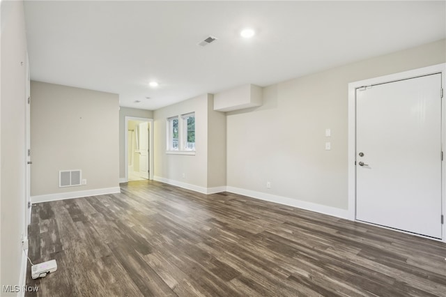 empty room with hardwood / wood-style flooring