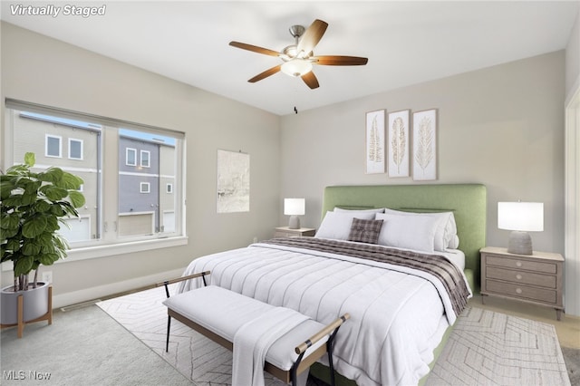 carpeted bedroom with ceiling fan