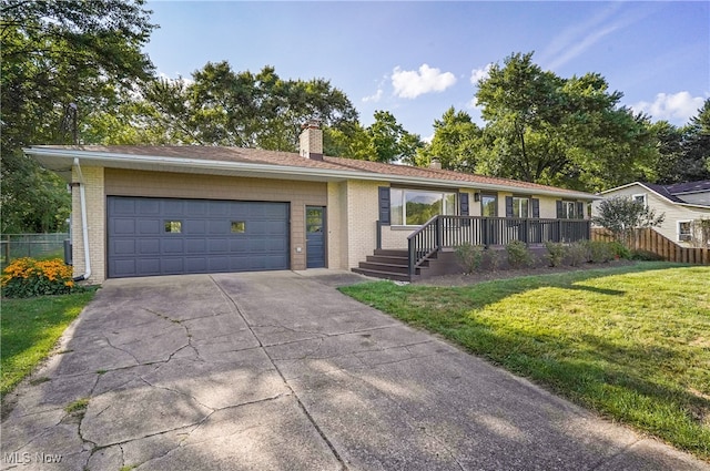 single story home featuring a front yard and a garage