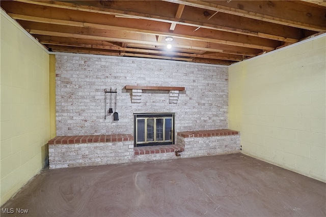 basement with a brick fireplace