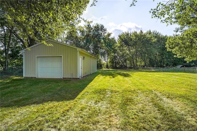 exterior space featuring an outbuilding and a garage