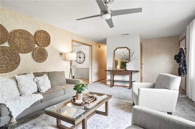 living room featuring light carpet and ceiling fan