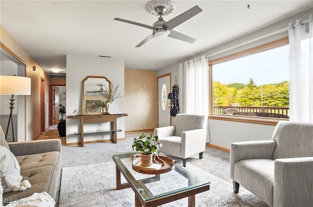 living room featuring light carpet and ceiling fan