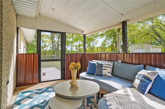 sunroom / solarium featuring lofted ceiling and wooden ceiling