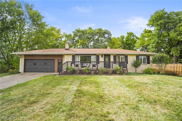 ranch-style home with a front yard and a garage