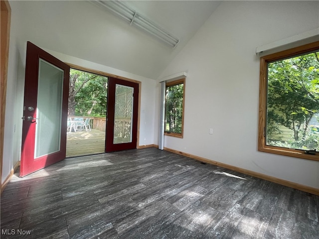 unfurnished room with lofted ceiling and french doors