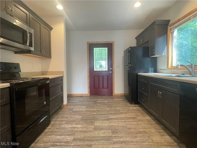 kitchen featuring sink and black appliances